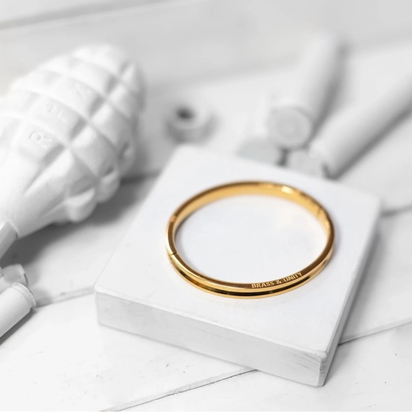 BRASS AND UNITY GOLD UNITY BANGLE 
GOLD PLATED STAINLESS STEEL - Picture 1 of 6